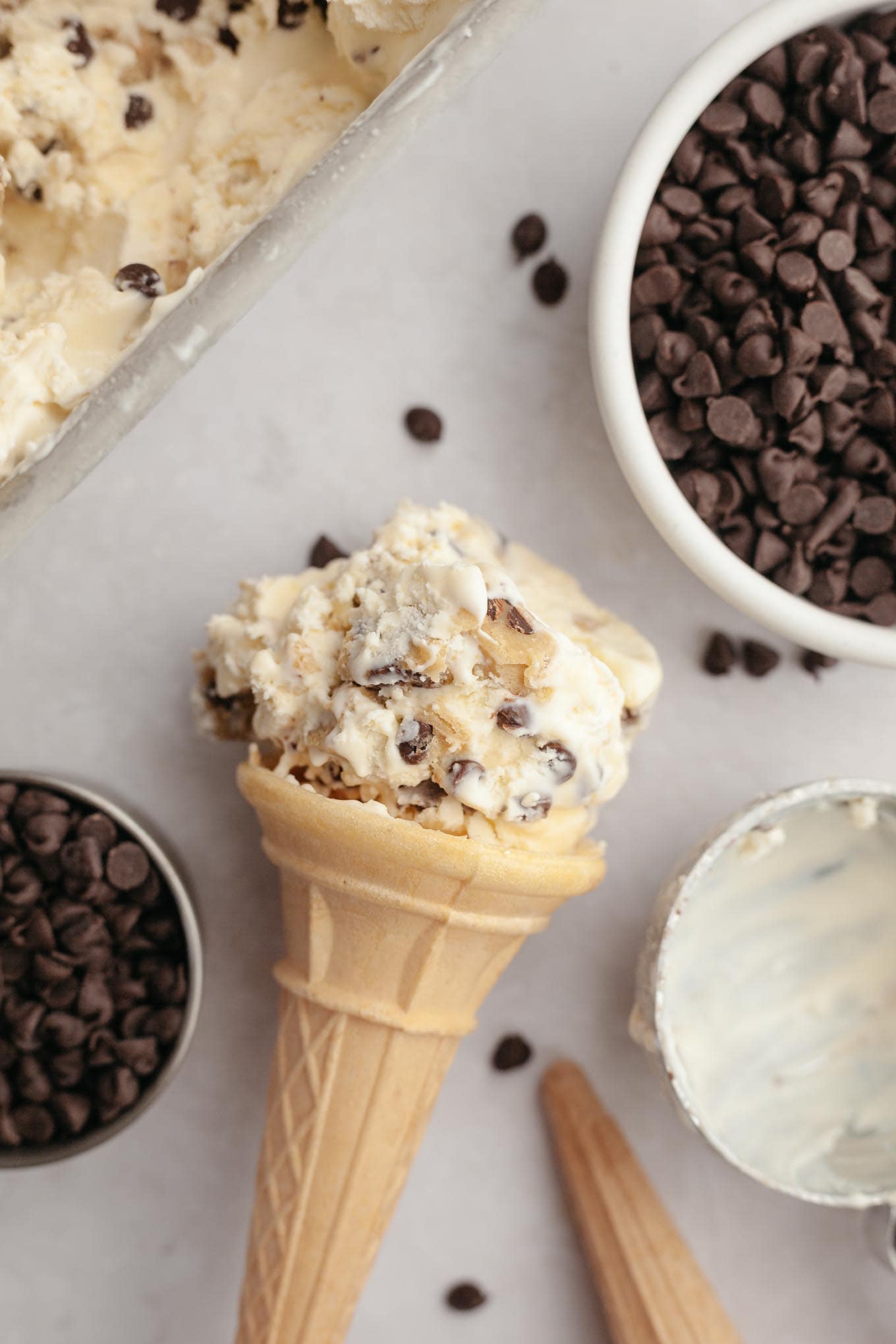 An overhead view of an ice cream cone lying on its side. 