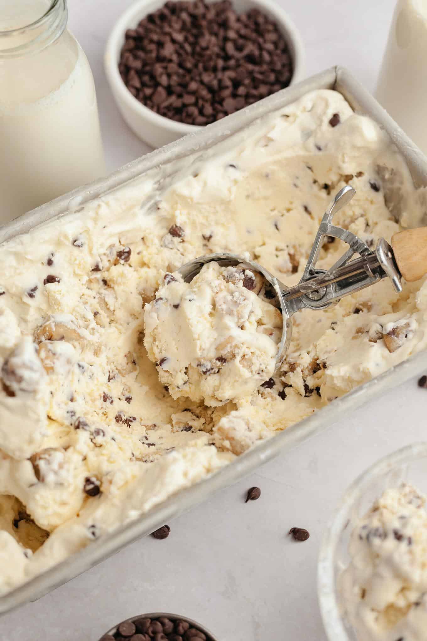 A loaf pan filled with cookie dough ice cream.
