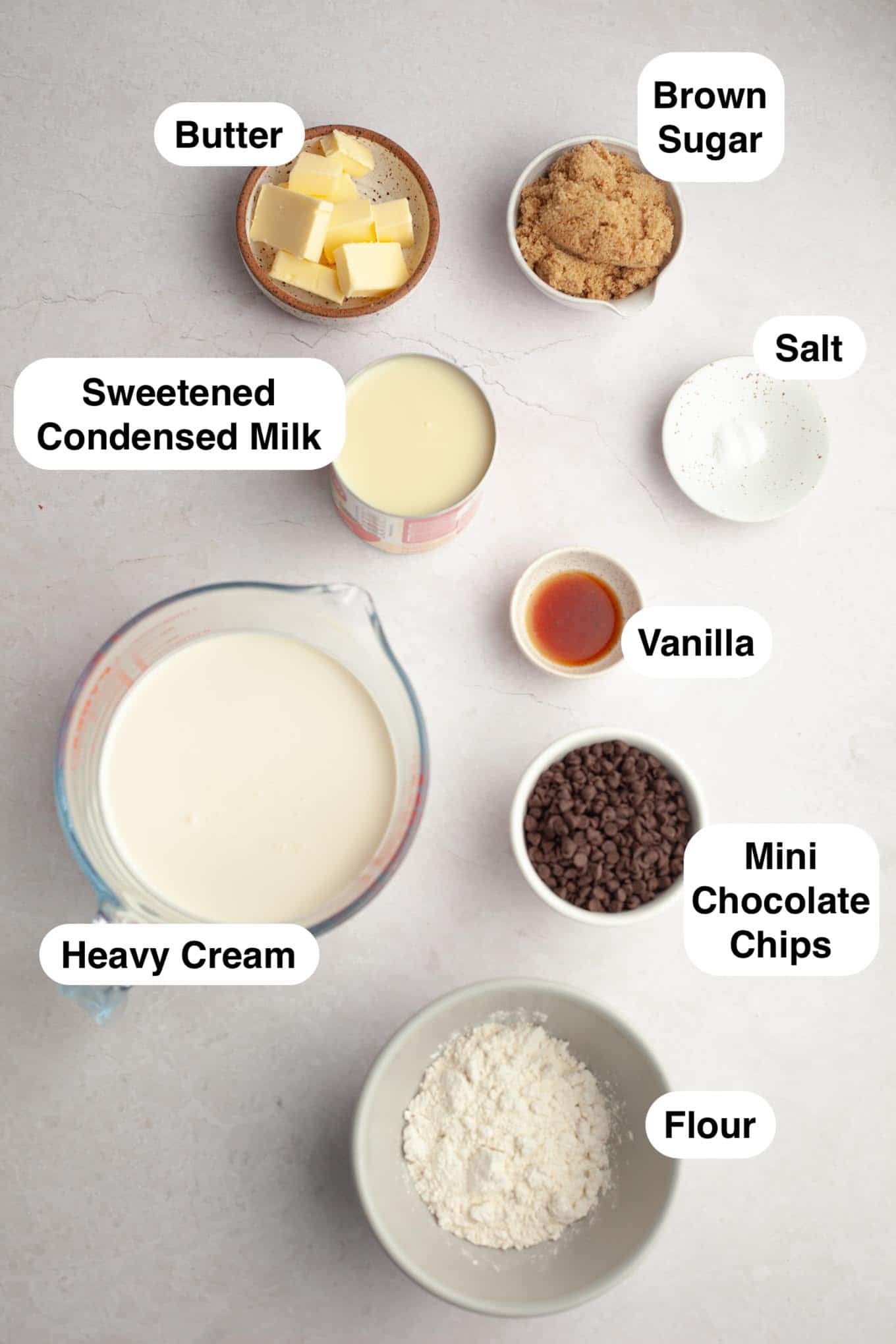An overhead view of the ingredients needed to make homemade cookie dough ice cream.