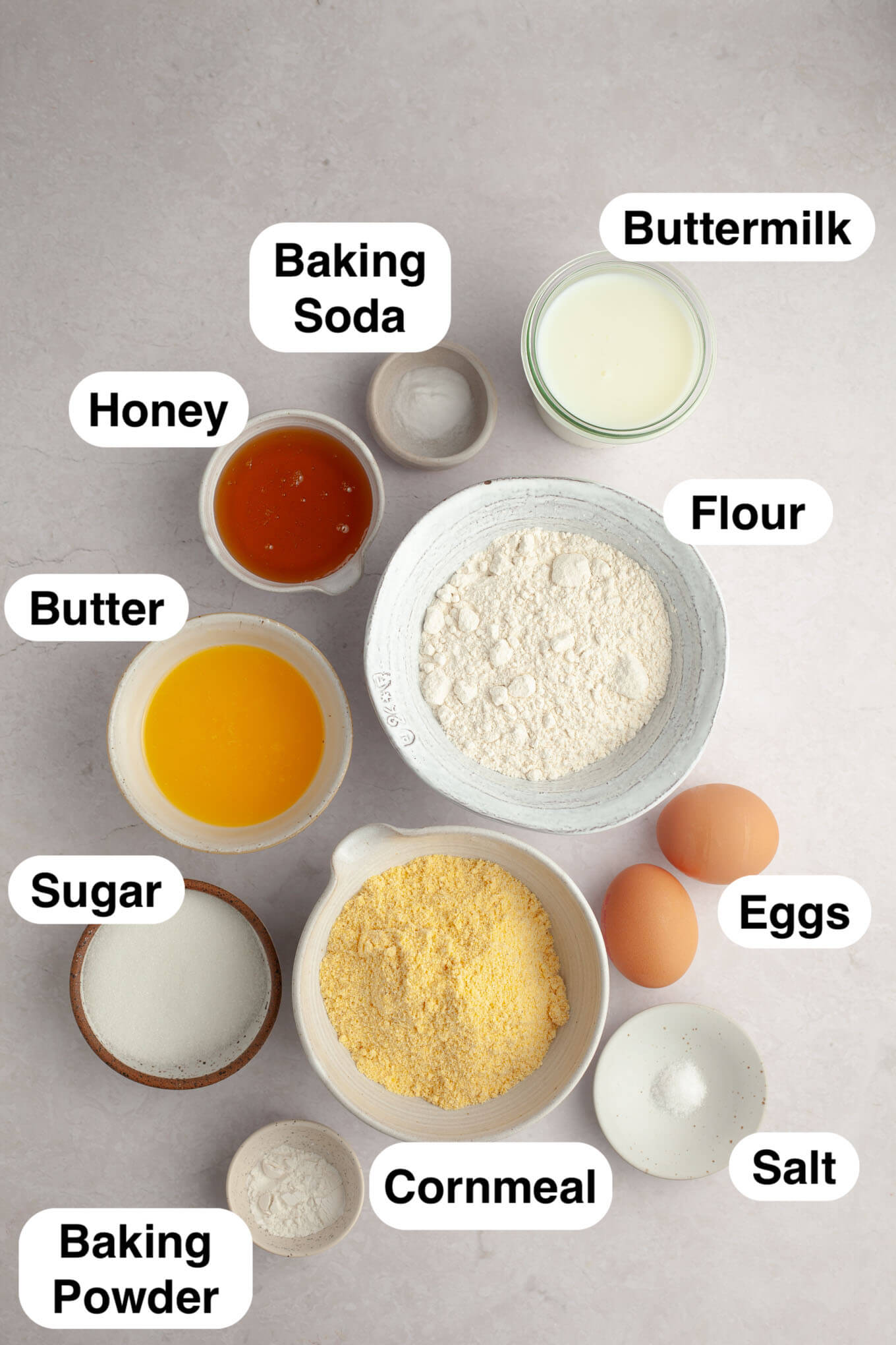 An overhead view of the ingredients needed to make cornbread muffins. 