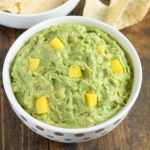 This mango guacamole makes a fun appetizer for any party and comes together in just a few minutes!  Serve it with some tortilla chips for a quick and easy appetizer or snack.
