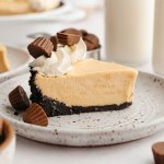 A slice of peanut butter pie on a white plate.