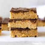 A stack of three scotcheroos with more in the background.