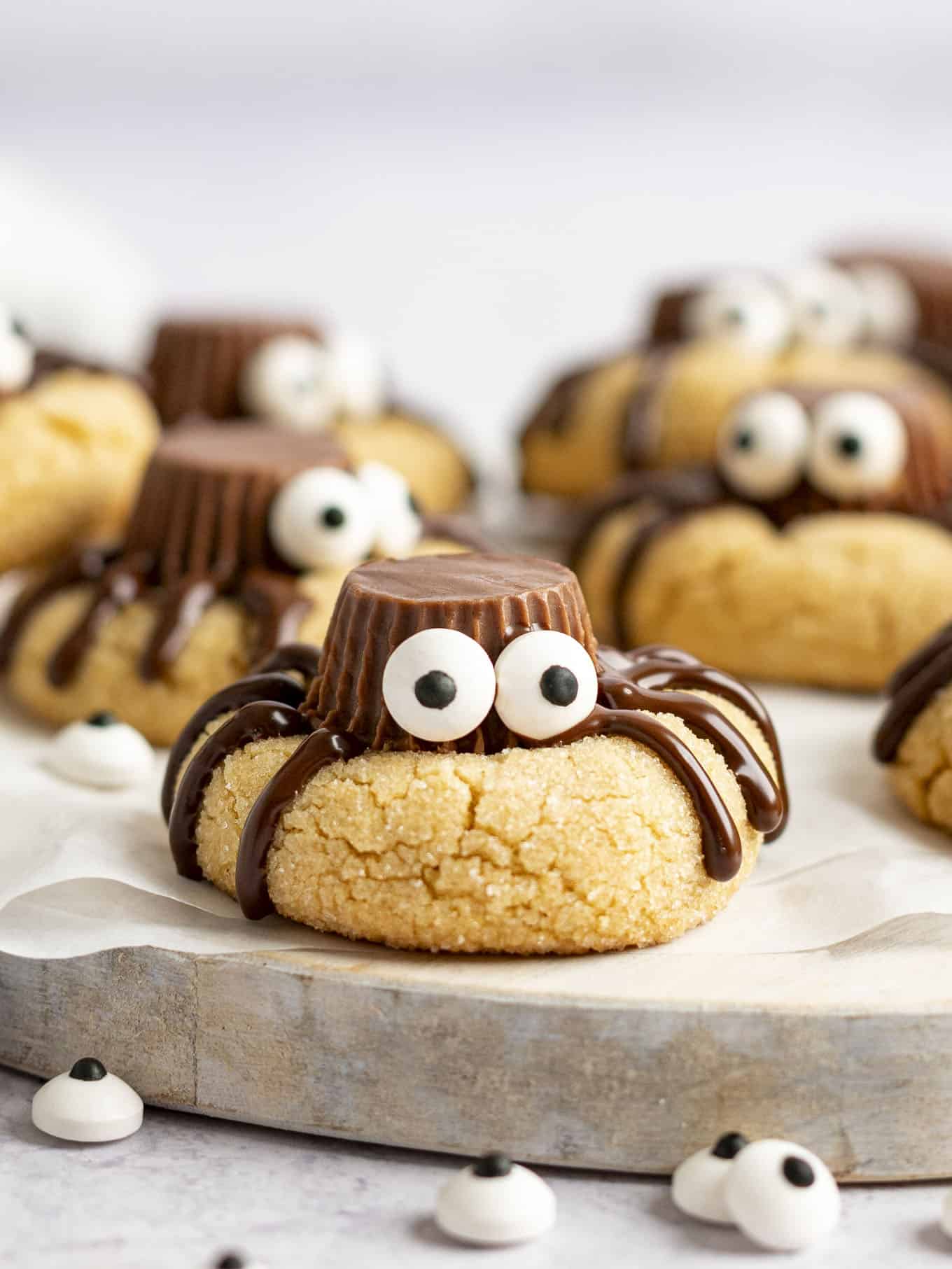 Spider Halloween cookies on a serving board. 